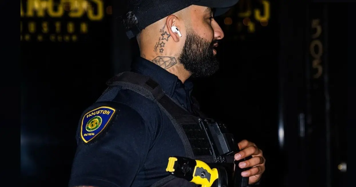 Houston Tactical Agency officer on a night post
