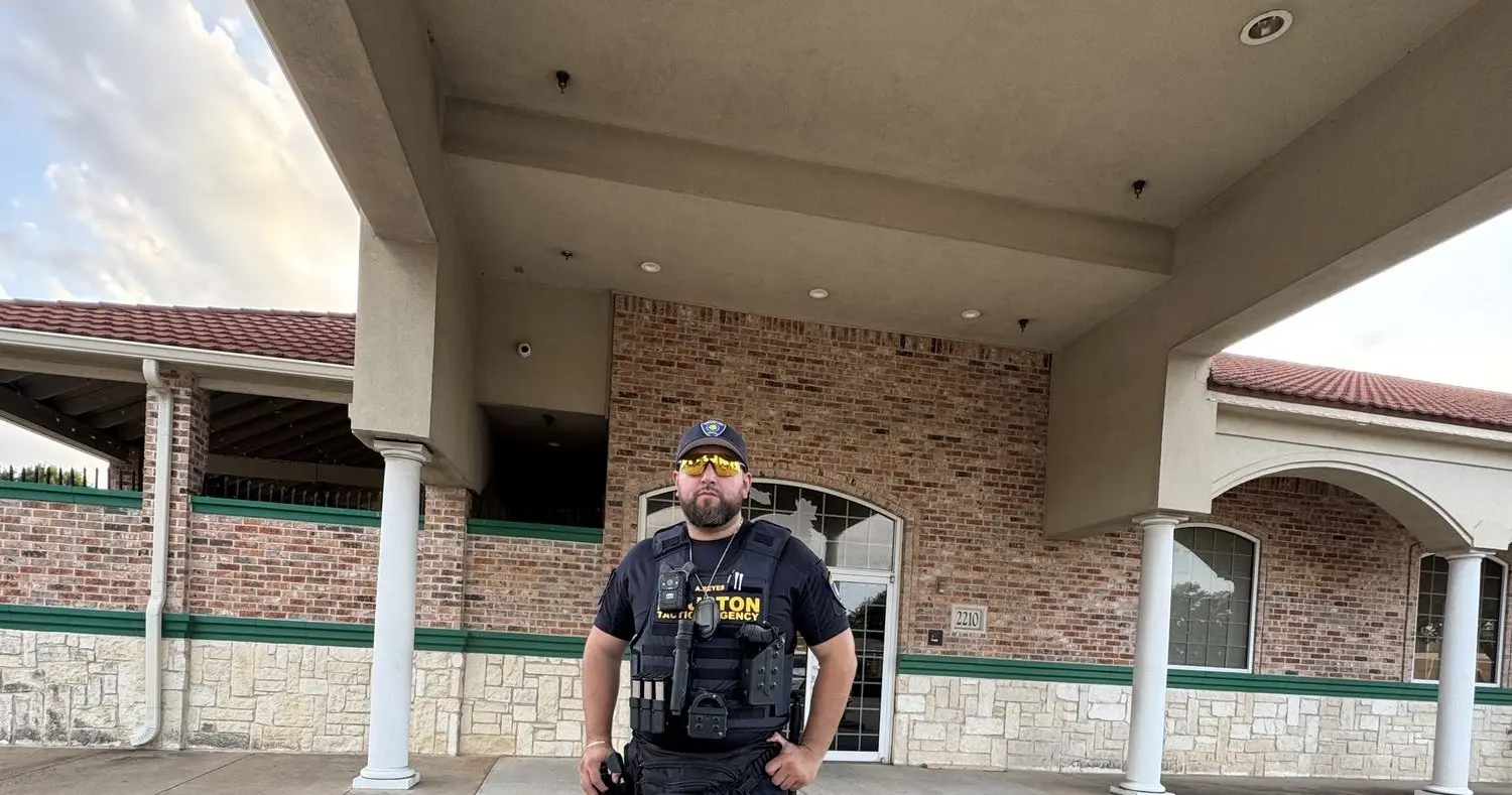 Houston Tactical Agency officer standing a commercial post