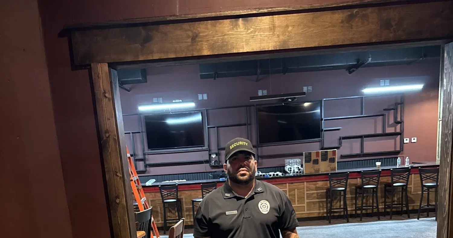 Event security officer posted at a Houston venue door